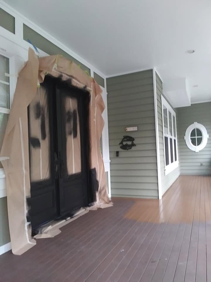 Masked entry door spray-out